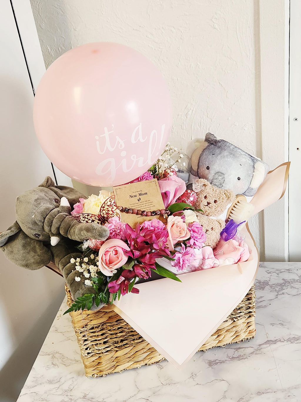 Baby girls welcome gift basket